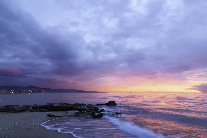 Peaceful coastal beach at sunset suitable for an evening walk